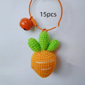 Orange and green carrot keychain pendant made from wool, shown on a key ring