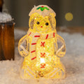 Glowing LED gingerbread man snowman Christmas ornament with a red scarf, measuring 6.5cm by 4cm by 10.5cm.