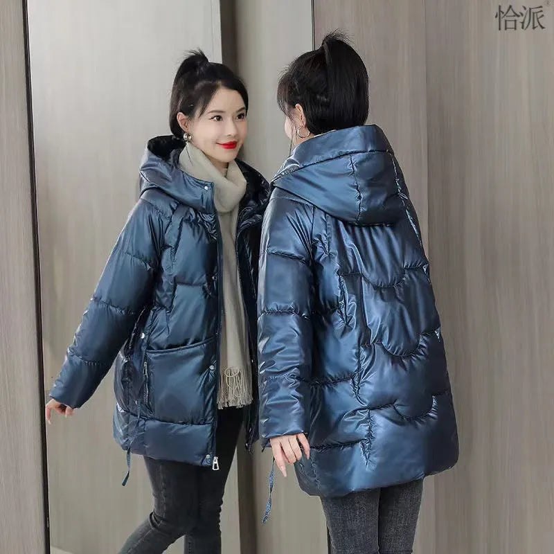 A loose-fitting, thick hooded winter jacket for women in a champagne colour, showcasing long sleeves.