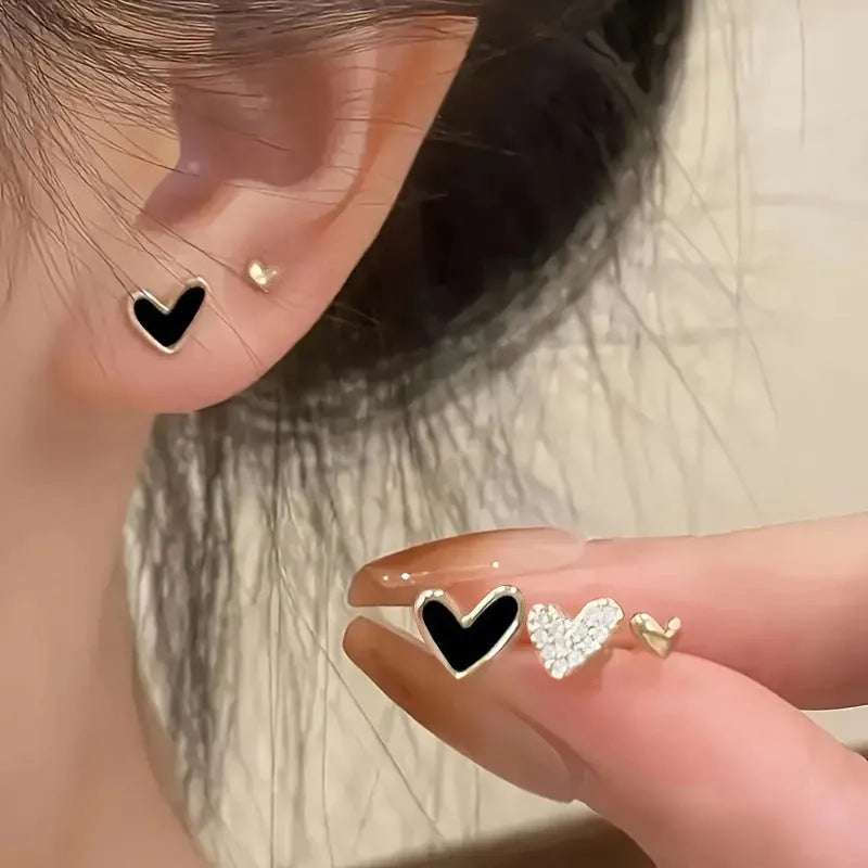 Three pairs of women's heart-shaped alloy earrings in coordinated set with electroplated finish