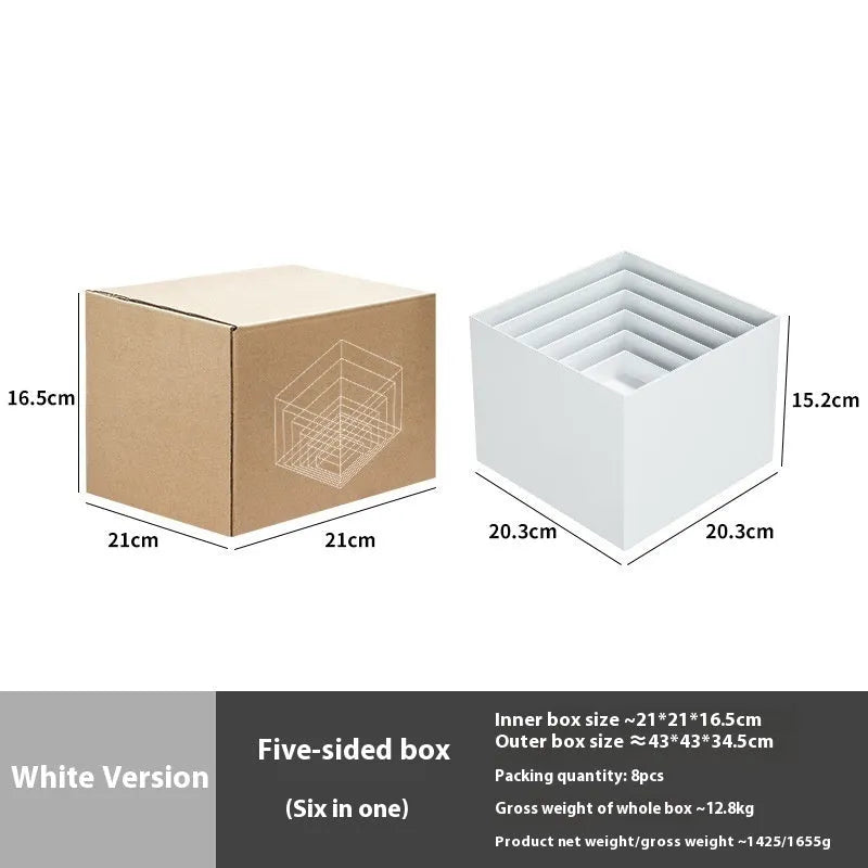 White plastic suit cube stacking dessert display stand with six pieces arranged for cake presentation.