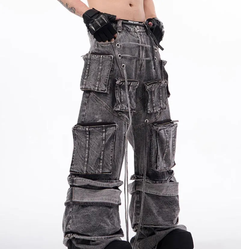 Grey cotton denim distressed overalls with rope stitching in mop pant style on model