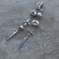 Geometric XINGX pendant earrings with antique silver plating and rhinestone details