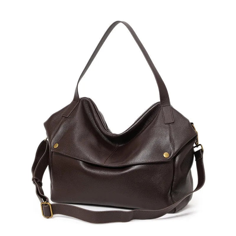 Brown genuine leather women's shoulder bag with horizontal square design showing interior zippered compartment
