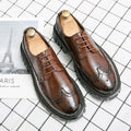 Men's classic black and brown brogue Oxford shoes with round toe and perforated detailing for formal business wear.