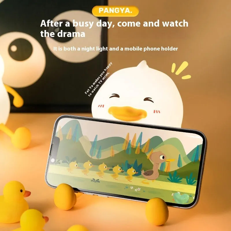 Chubby night light desk lamp with silicone phone holder surface showing three brightness settings