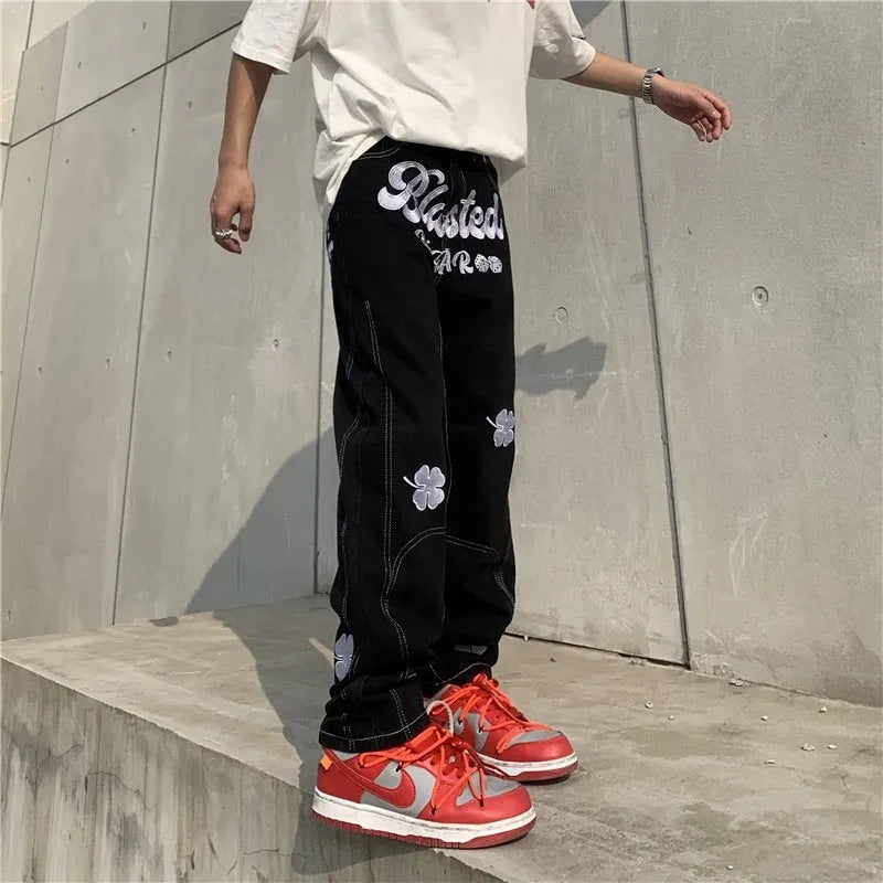 Men's American retro printed casual trousers with button placket and small straight leg in graphic colour