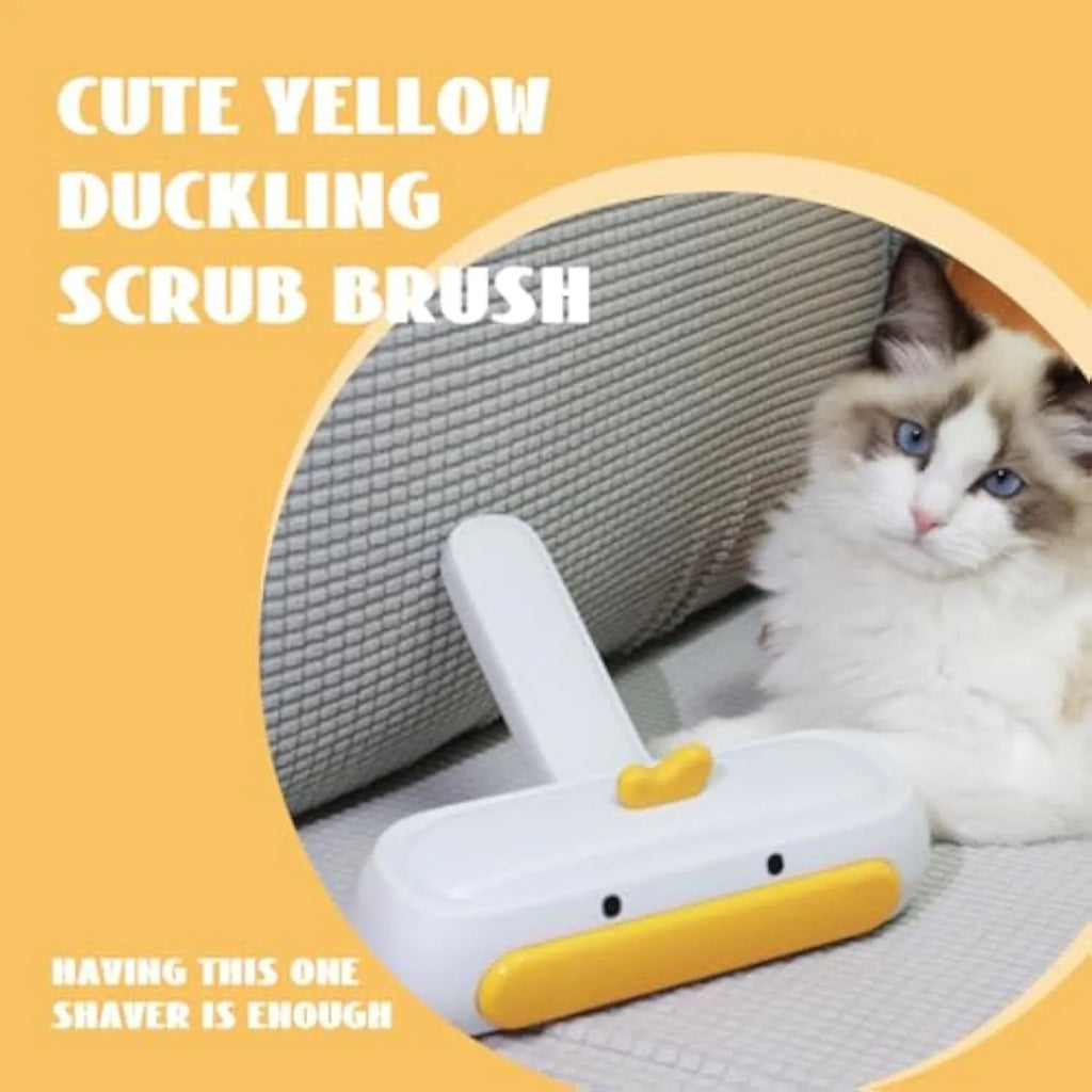 Portable yellow pet hair remover brush with duck design on a fabric sofa.