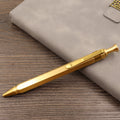 Retro brass tactical pen with bolt-action press mechanism and brushed finish.