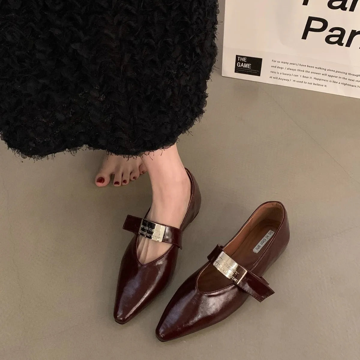 Women's pointed toe Mary Jane shoes in black with low heel and buckle fastening