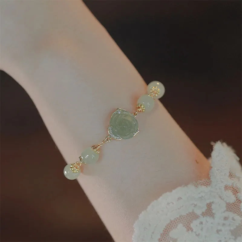 Women's bracelet with Hetian jade rose flower design and 14K gilded construction