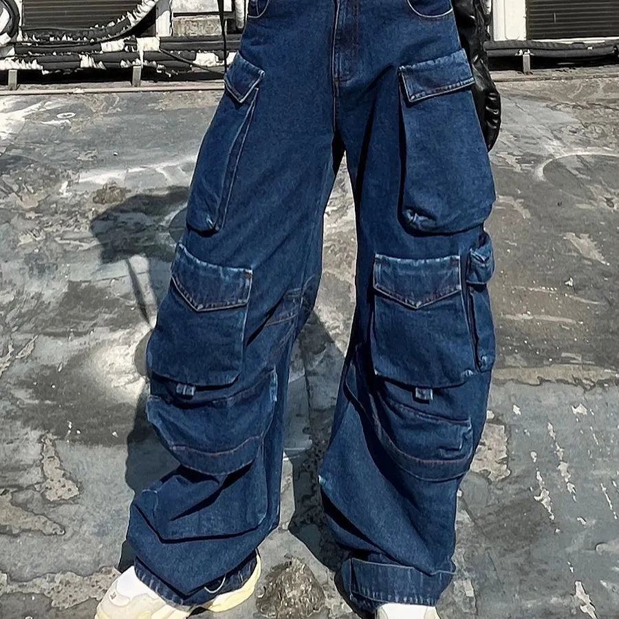 Dark blue distressed women's jeans with wide legs, high waist, and multiple pockets on a neutral background.