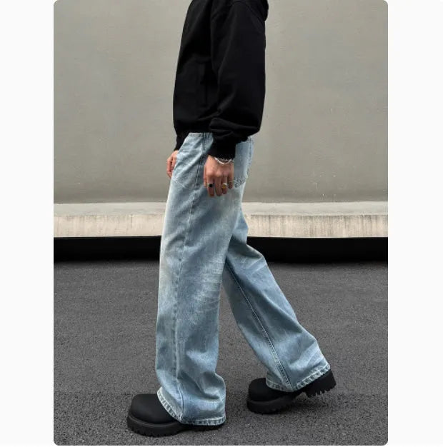 Men's retro whisker washed blue straight jeans with visible stitching and medium-high waist.
