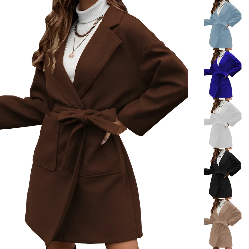 Man wearing a thick brown minimalist belted coat with lapel collar and button front in a casual setting.