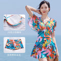 Colourful printed one-piece swimsuit for women available in sizes M to 3XL with belly coverage