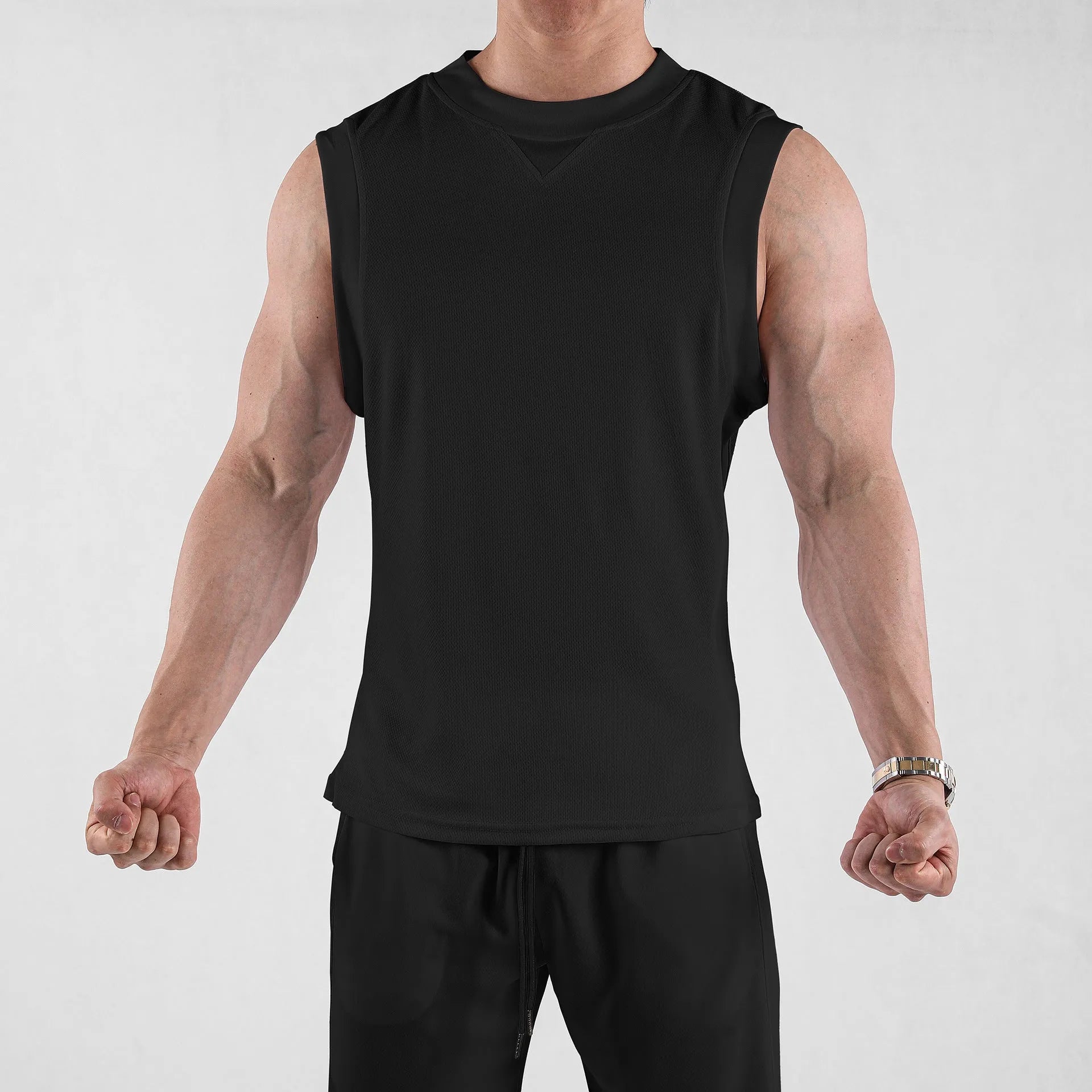 Men's black and white polyester fitness vest in loose fit design for summer workouts