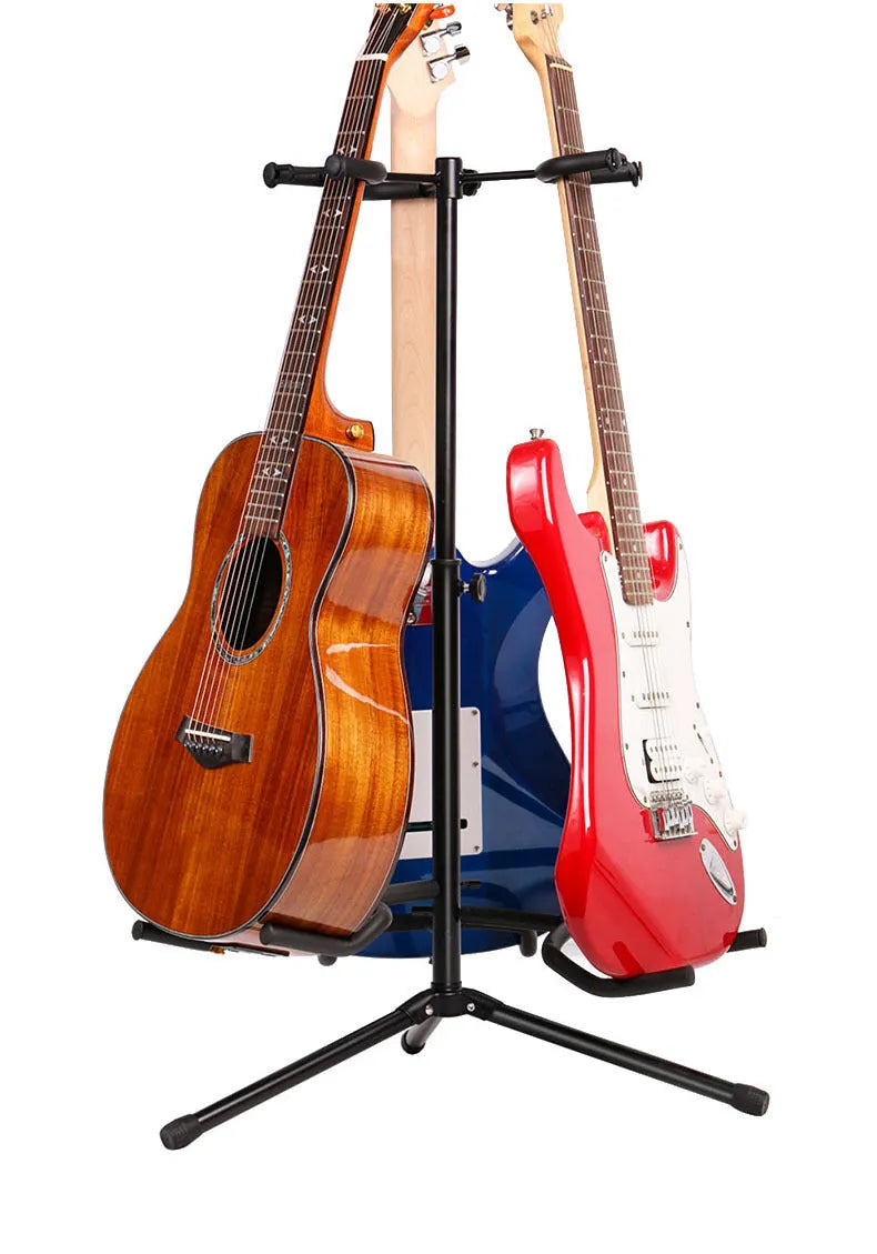 Black vertical double-headed iron guitar stand holding an acoustic guitar upright.