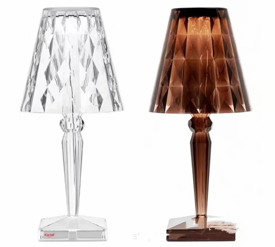 Rose gold plated portable touch control LED night light with acrylic shade on a table.
