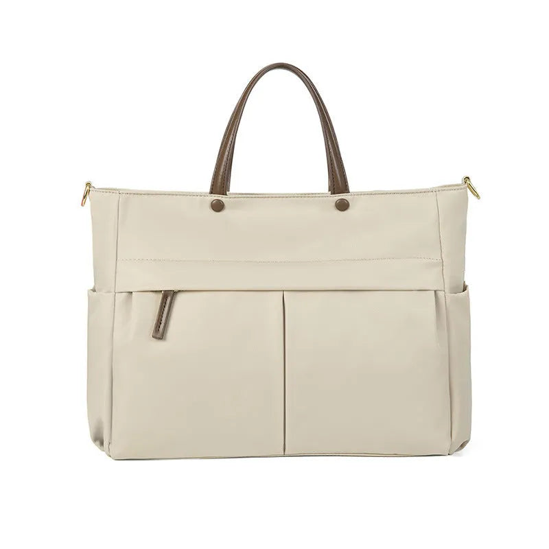 Women's Oxford cloth laptop briefcase showing elegant black colour with multiple open pockets and portable handle