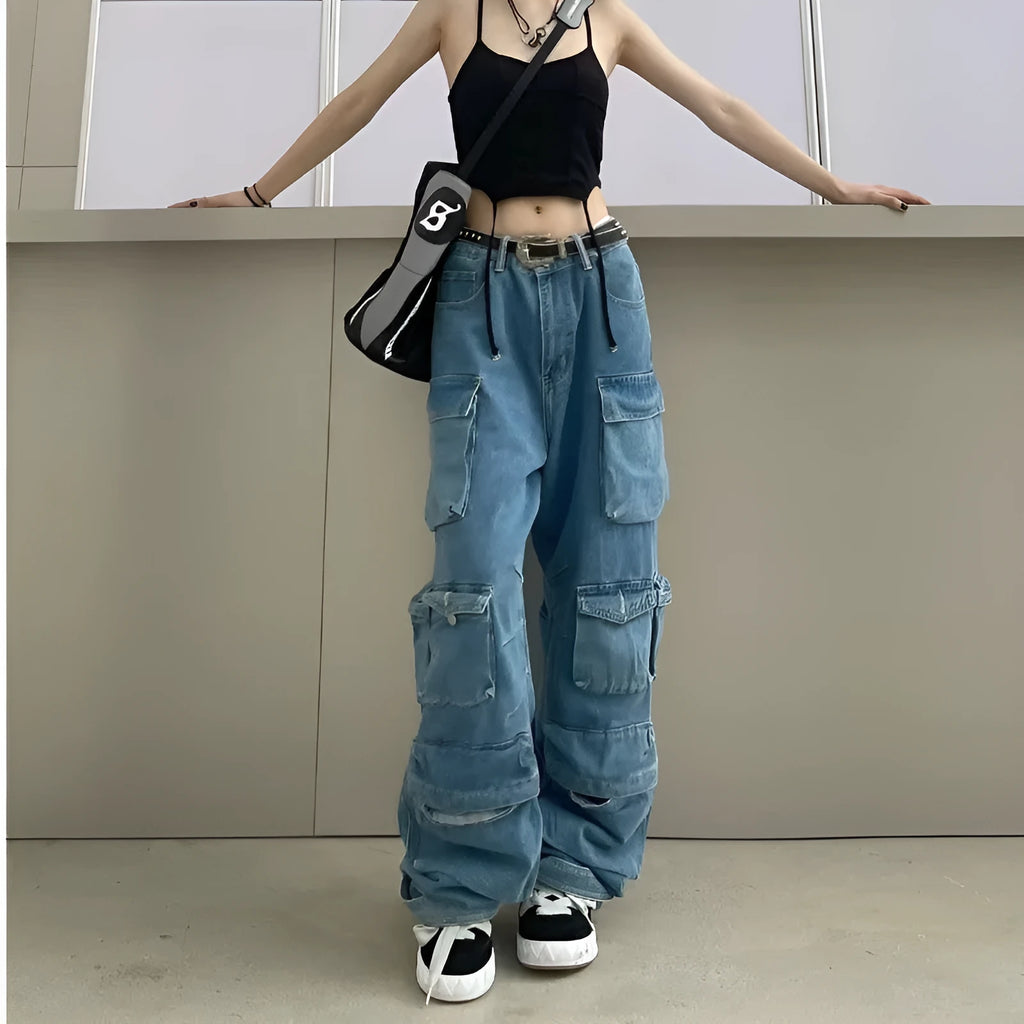 Blue high waist wide leg women's trousers with multiple pockets on a street style background.