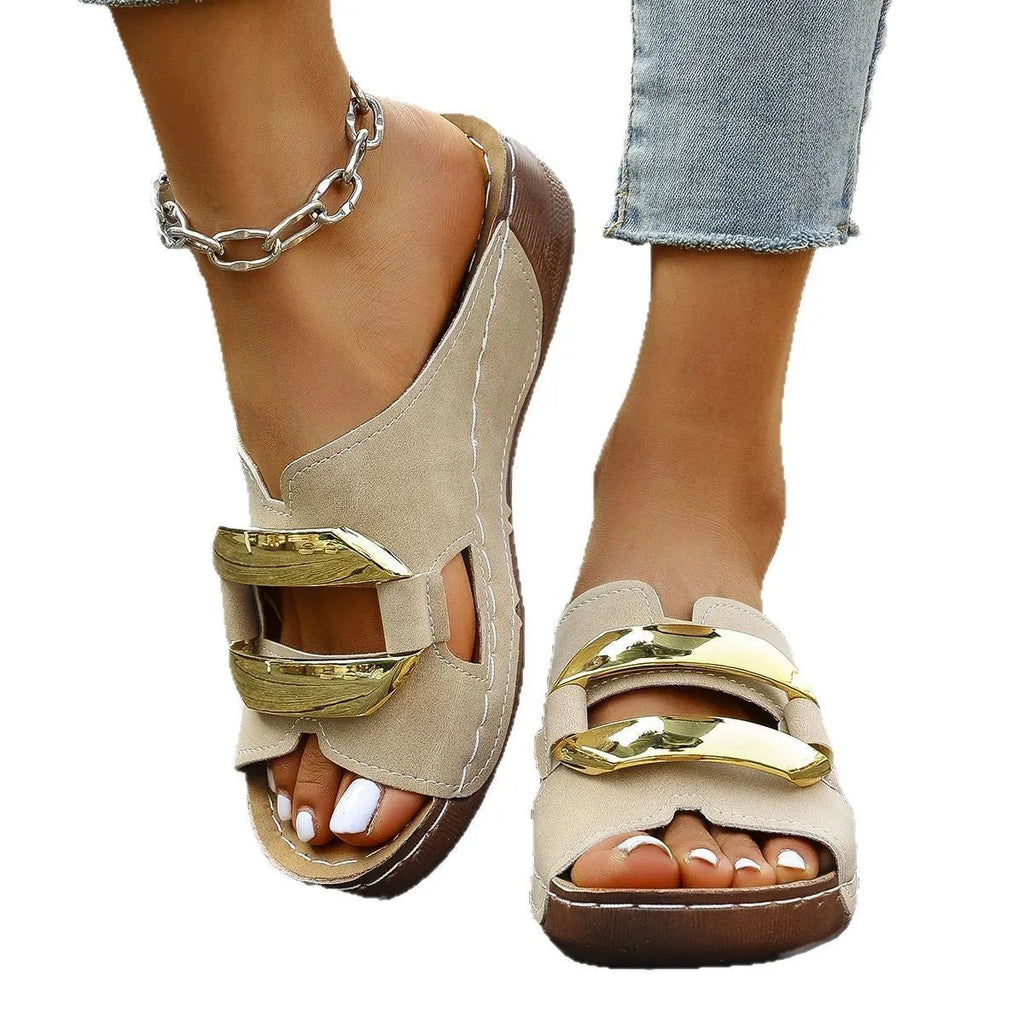 Women's Roman style platform sandals in black, showing strapped design and flat rubber sole.