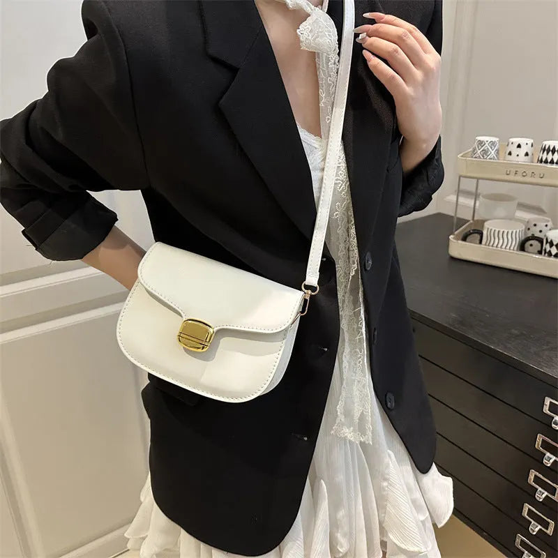 Simple PU leather handbag for women with zipper closure, available in multiple colours including black, brown, and green