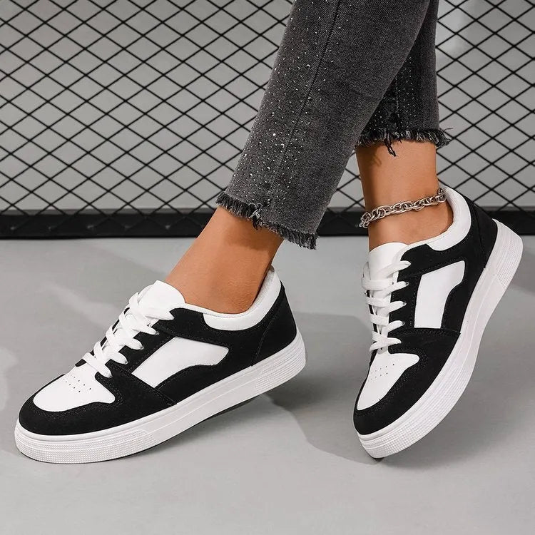 Black women's rubber casual sports shoes with flat heel, low top, round toe, and front lace-up closure