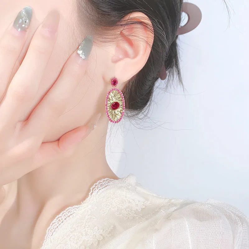 Gold-plated jewellery set with simulated red corundum stones, water drop shape, diamond cut finish, necklace ring ear studs