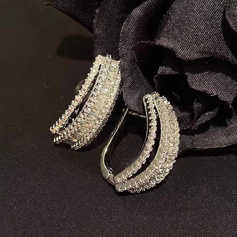 Women's white gold colour geometric stud earrings with zircon stones on copper base