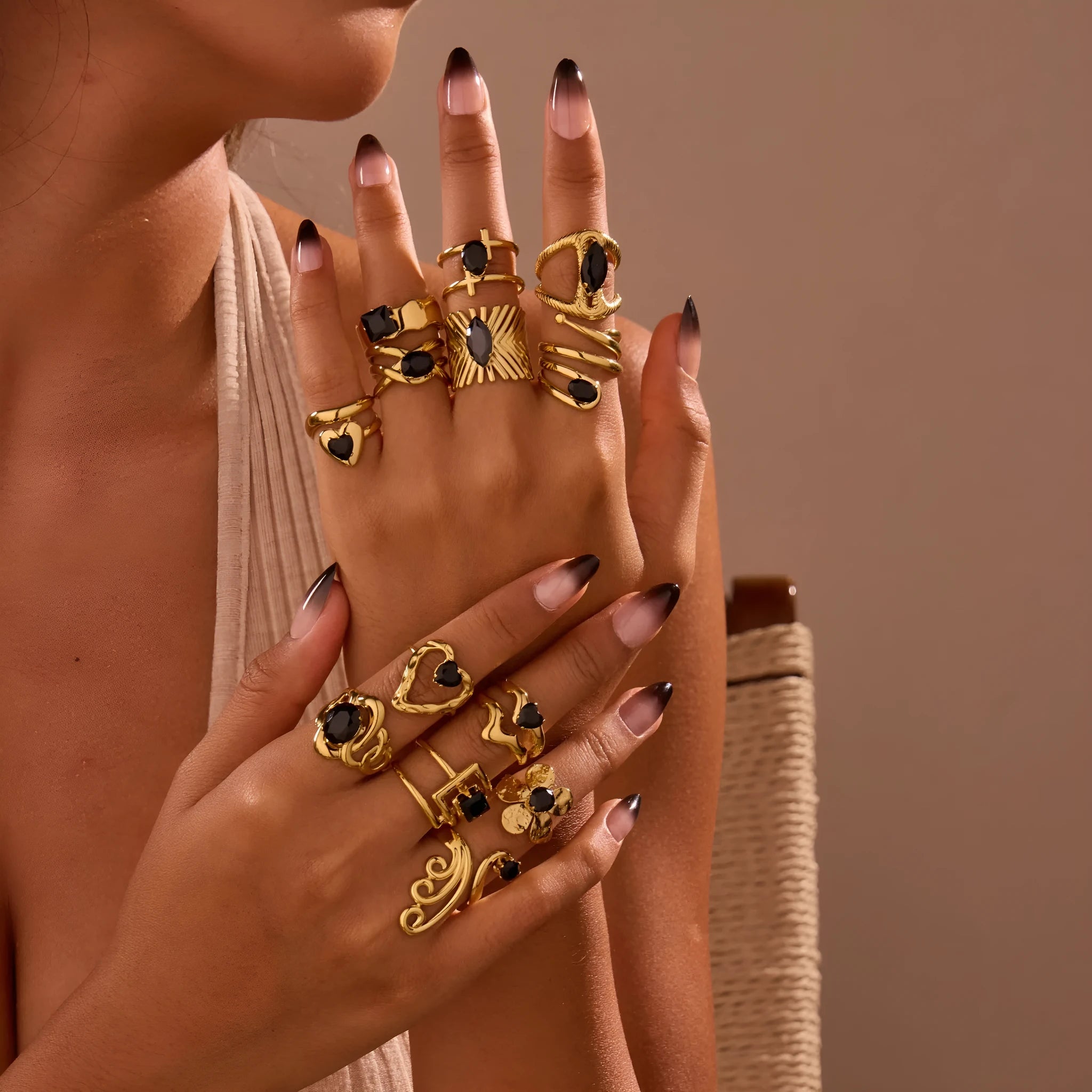 Women's adjustable titanium steel ring with geometric shape and inlaid zircon detailing on a finger.