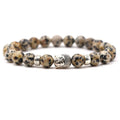 Tigereye Buddha Head natural stone stretch bracelet with 8mm beads on a wrist.