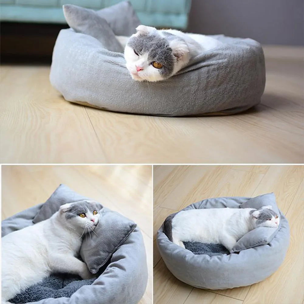 Round grey dog bed with fluffy rim and matching pillow on a non-slip Oxford cloth base.
