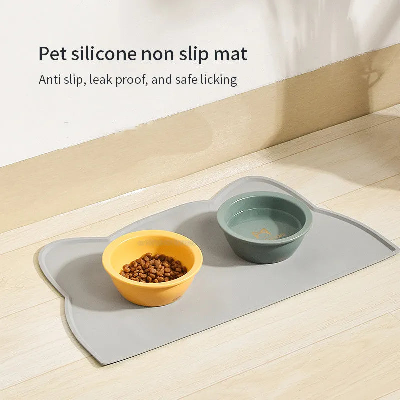 Blue silicone waterproof pet feeding mat with cat head shape, 44 by 24 centimetres