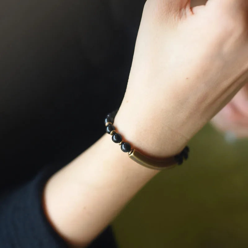 Layered retro ethnic bracelet featuring natural red jasper, obsidian, and water grass agate stones with brass elements