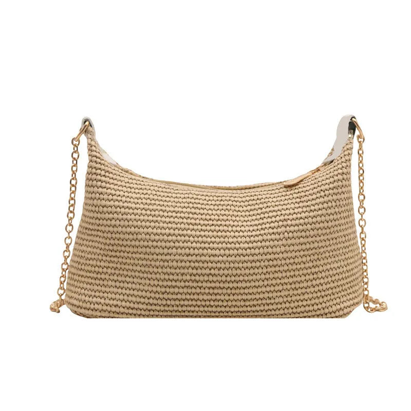 Vacation style straw woven beach shoulder tote bag in horizontal square shape with sandwich pocket