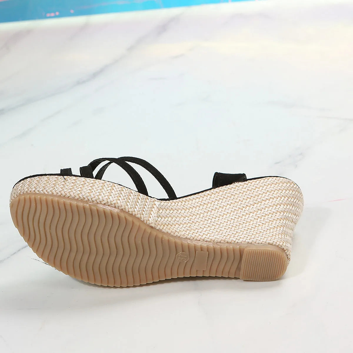 Women's black wedge sandals with a fish mouth open toe and cloth upper.