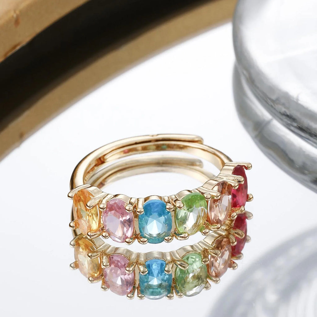 Gold-colour adjustable zircon ring with a simple retro design on a white background.