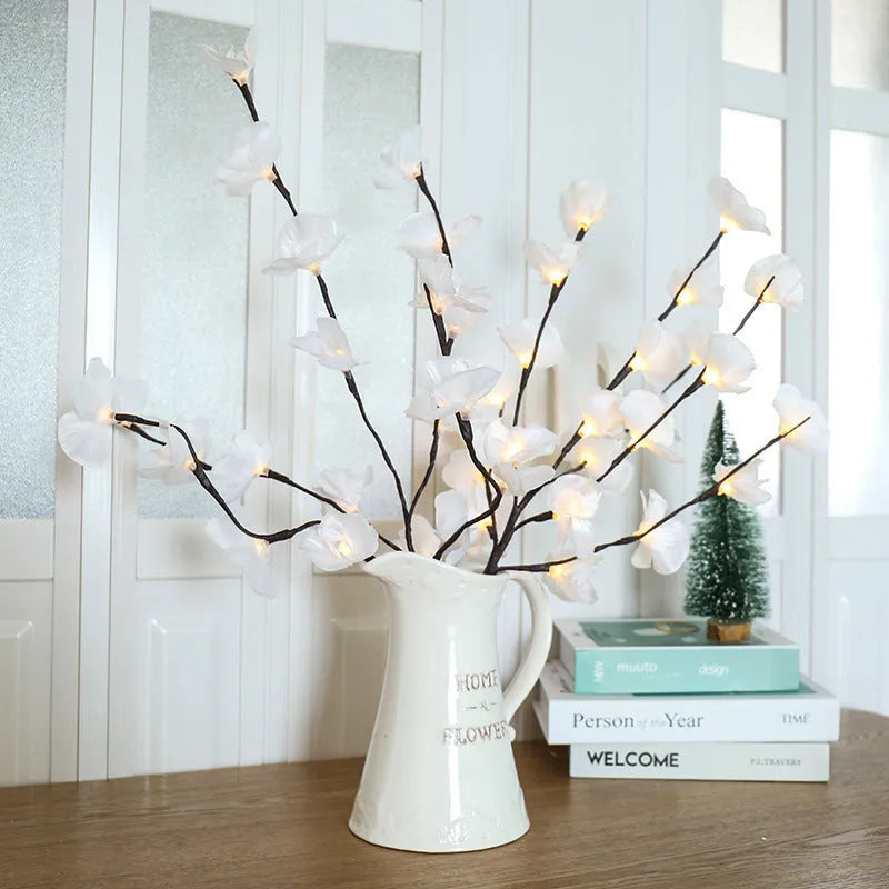 Pink Phalaenopsis branch shaped decorative LED light with 20 warm white lights, powered by batteries.
