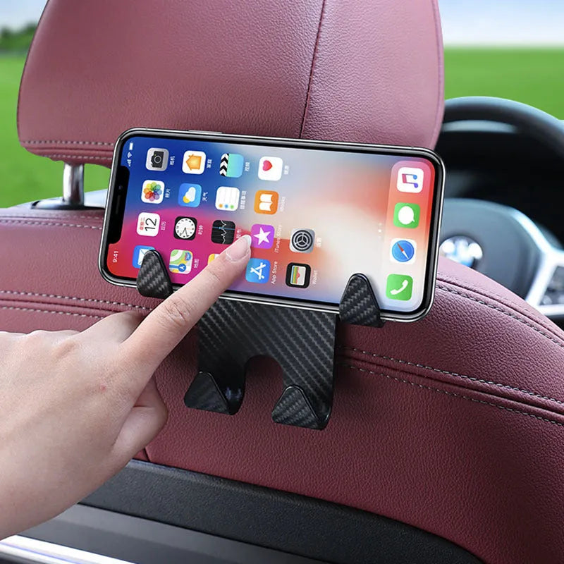 Black ABS plastic car seat back hook with integrated mobile phone holder bracket.