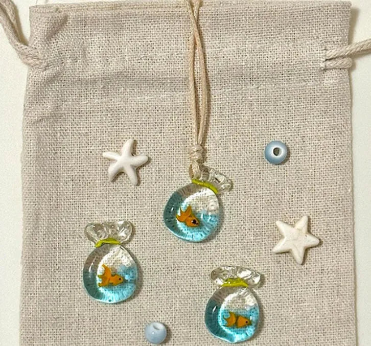 Women's necklace with a coloured glaze Joker pendant wearing a skirt on a cotton and linen chain.