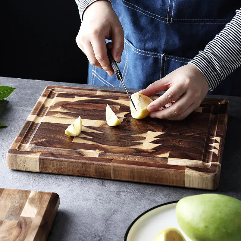 Brown parquet solid wood cutting board made from imported acacia, 3cm thick, on kitchen counter