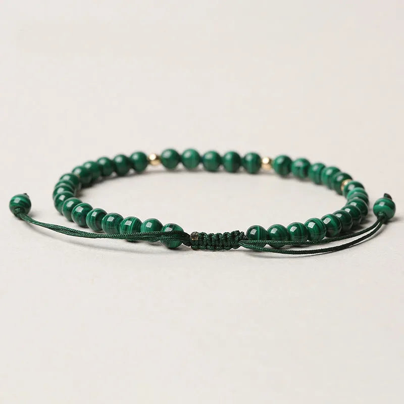 Natural malachite crystal bracelet for women with handwoven golden balls strap and textured green stone