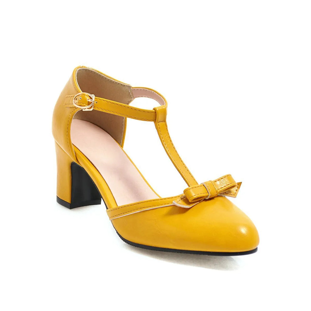 Women's apricot coloured chunky heel sandals with a buckle strap and bow tie detail on a 6.5cm heel.