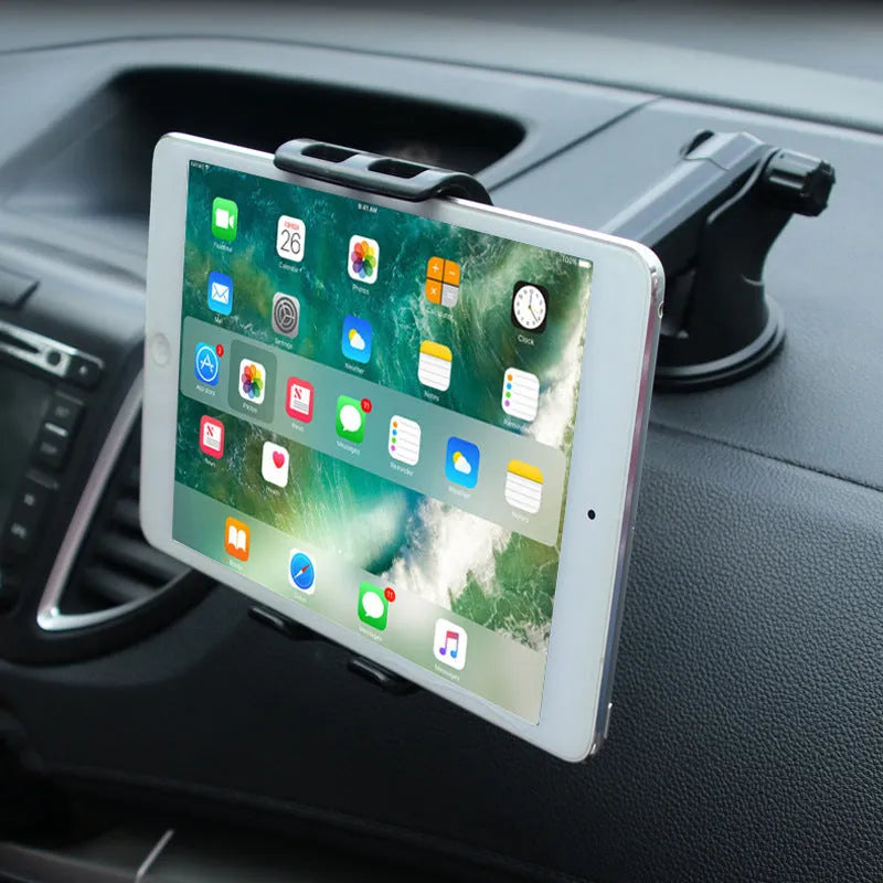Black tablet PC universal stand car bracket mounted on dashboard centre console holding a tablet