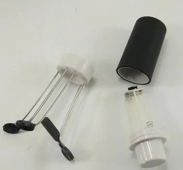 White and black wireless stir crazy mixer with stainless steel shaft on a kitchen countertop