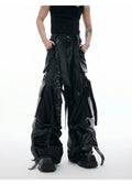 Black men's retro multi-pocket leather trousers with quilted stitching and loose fit.