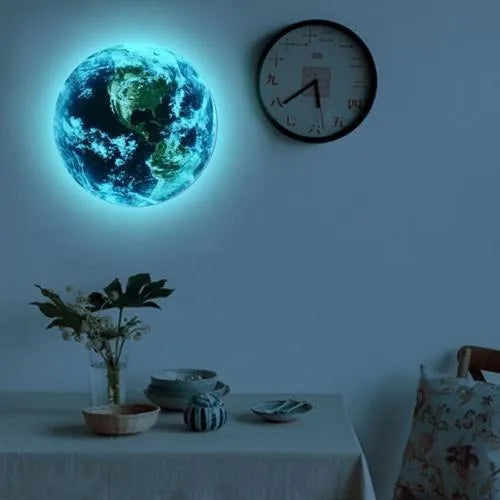 Glow in the dark 3D Earth planet wall sticker in multiple sizes on a wall.