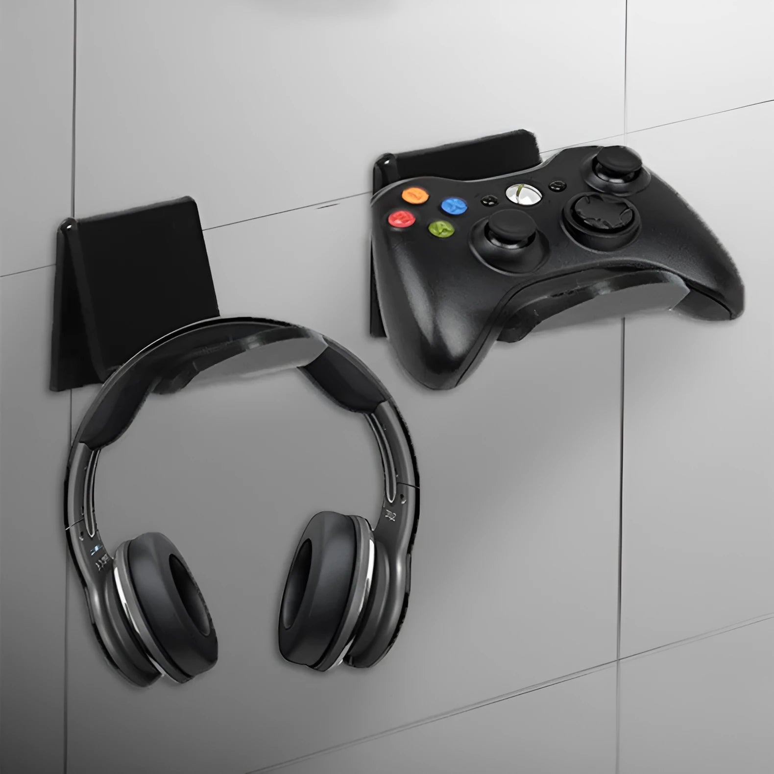 Universal game controller wall mount bracket holding PS5 DualSense controller in black plastic finish