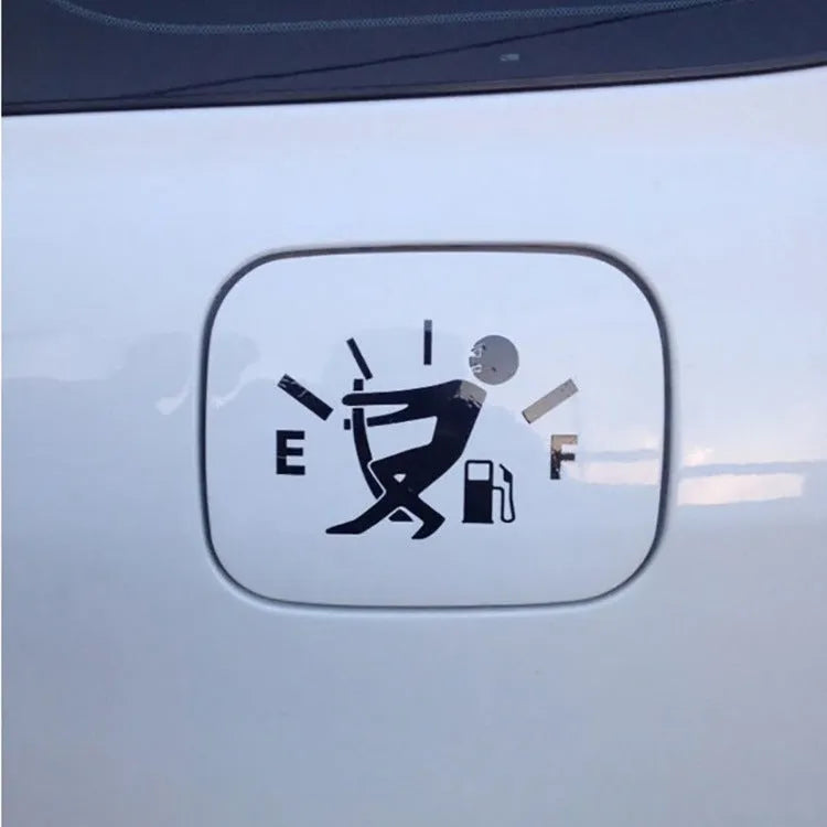 Reflective insufficient fuel car sticker 12.7cm x 9cm in black on a car dashboard