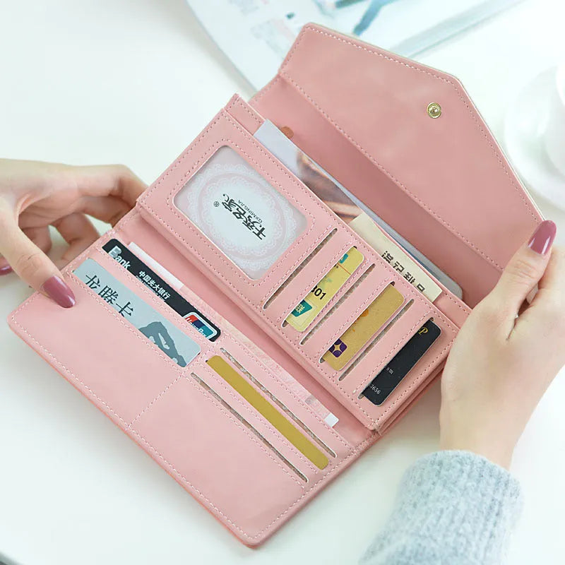 Women's three-fold buckle wallet in PU leather showing interior compartments and measuring 19.5cm by 10cm